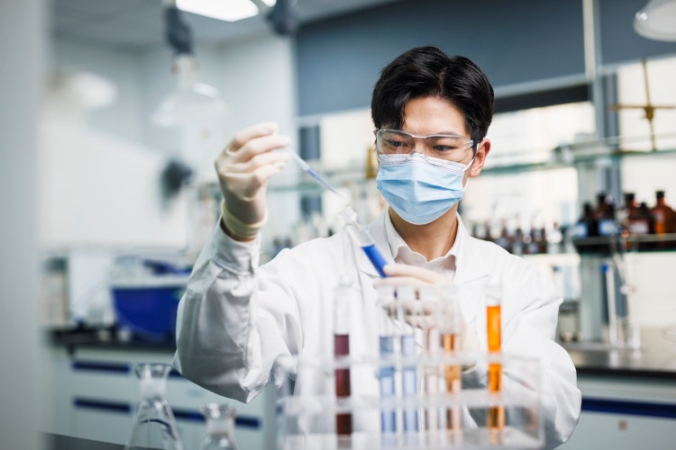 one asian male scientists work in laboratories